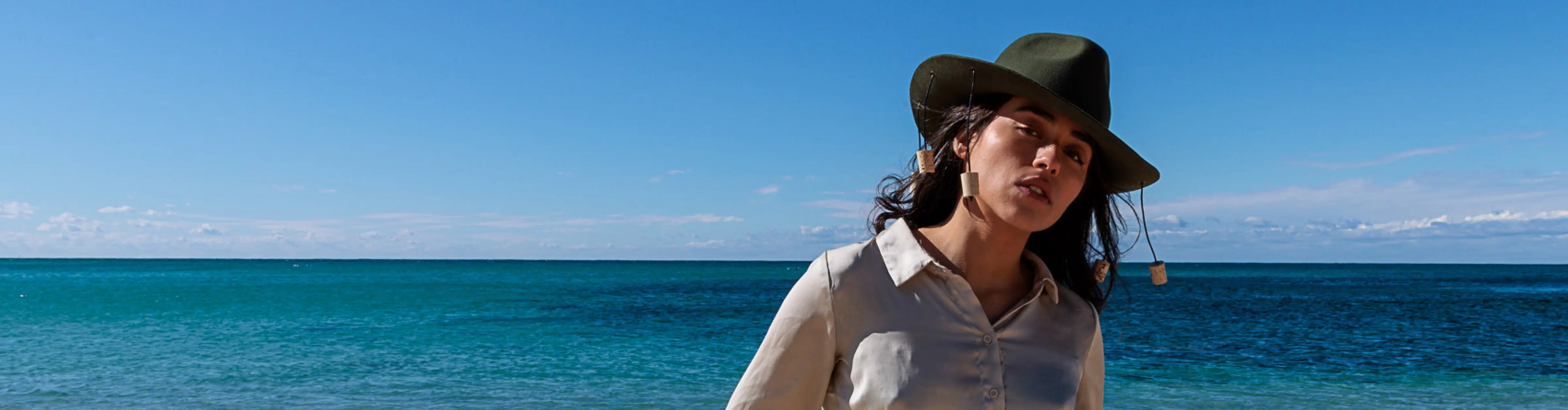 Women Wearing Corker Hat Posing on a Beach