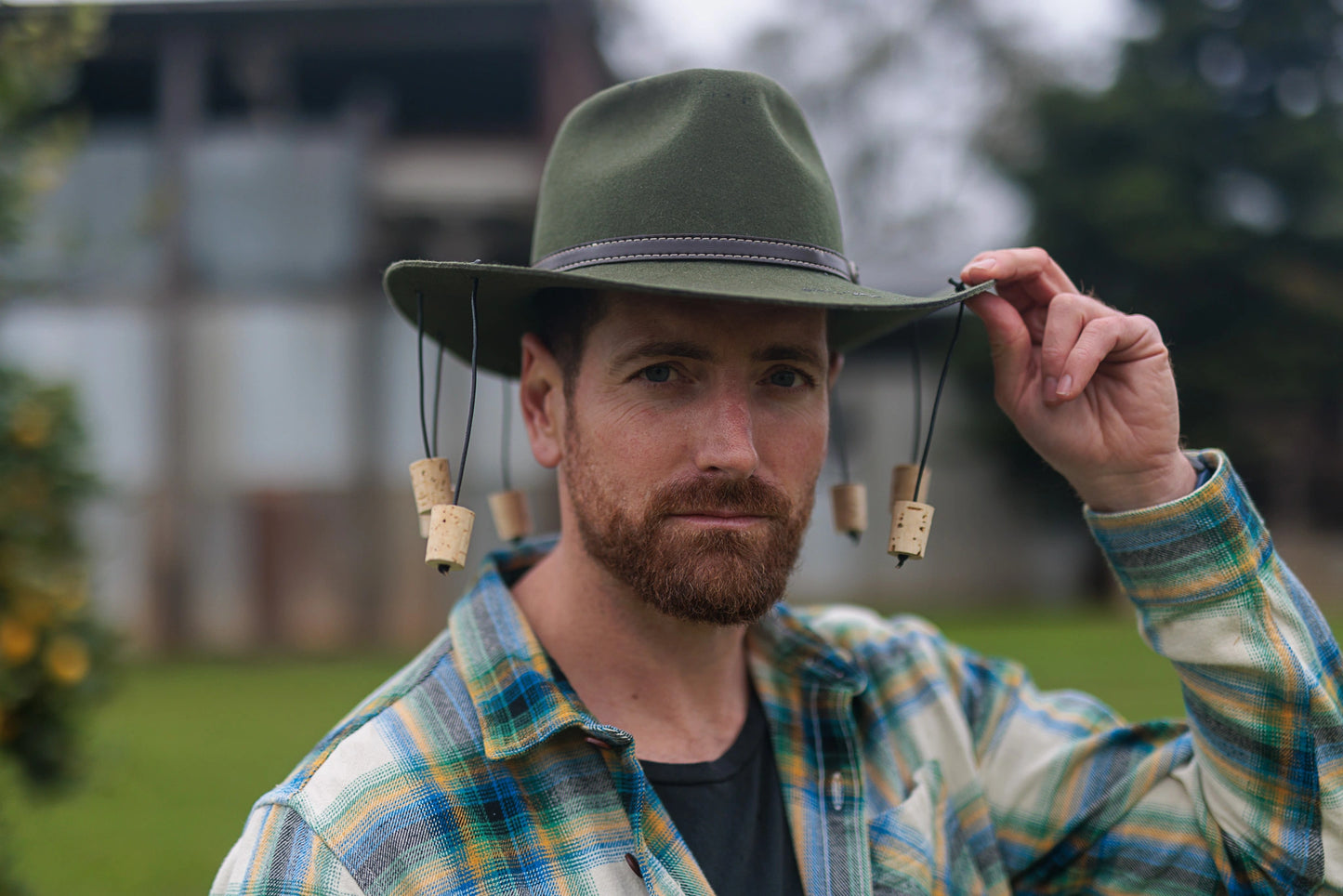 Man Posing for a Photo Wearing Green Corker Hat 