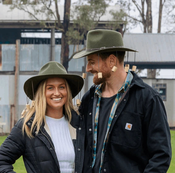 Couple Smiling and Posing Wearing Corker Hat 